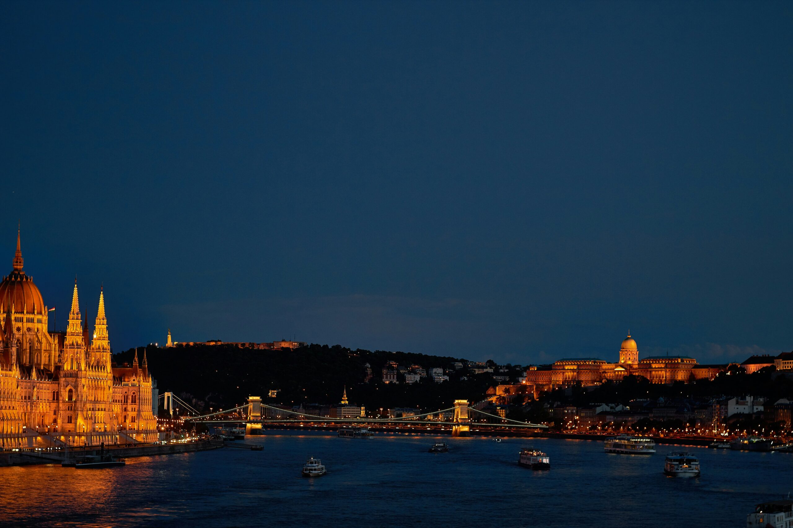 Budapest at night — Parliament building, Chain Bridge and Buda Castle illuminated along the Danube