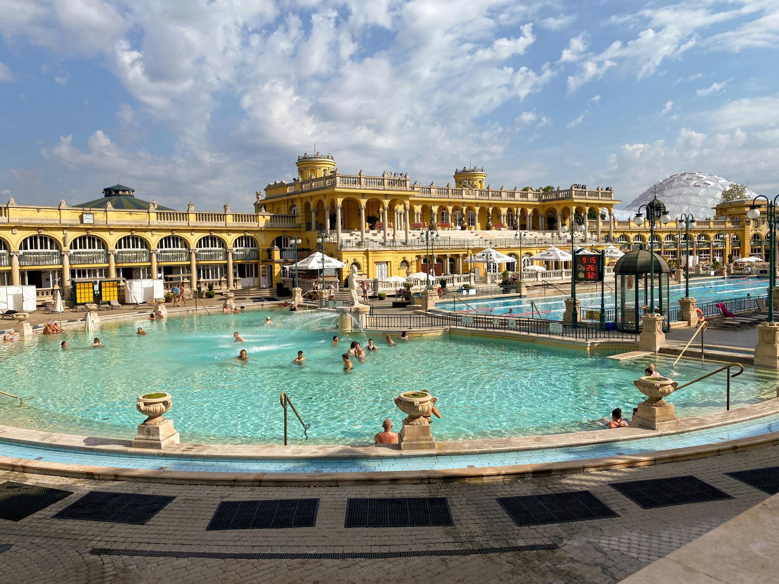 Széchenyi thermal baths outdoor pool, Budapest — turquoise water and the yellow neo-baroque facade